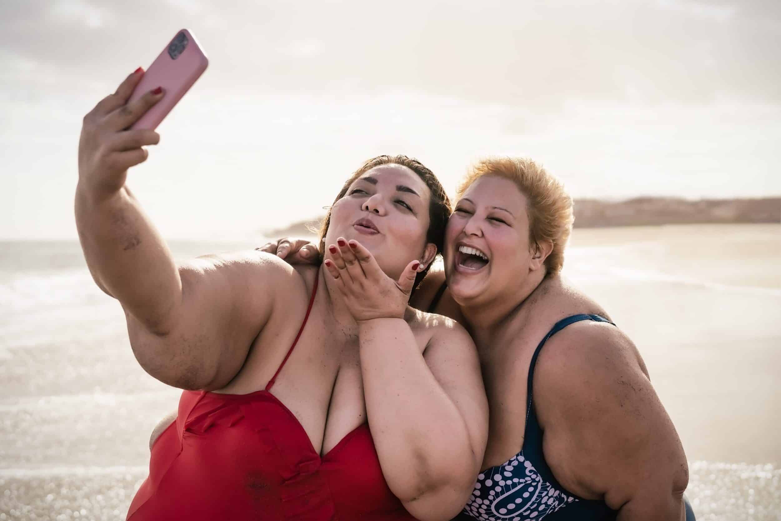 Happy,Plus,Size,Women,Taking,Selfie,With,Mobile,Smartphone,On